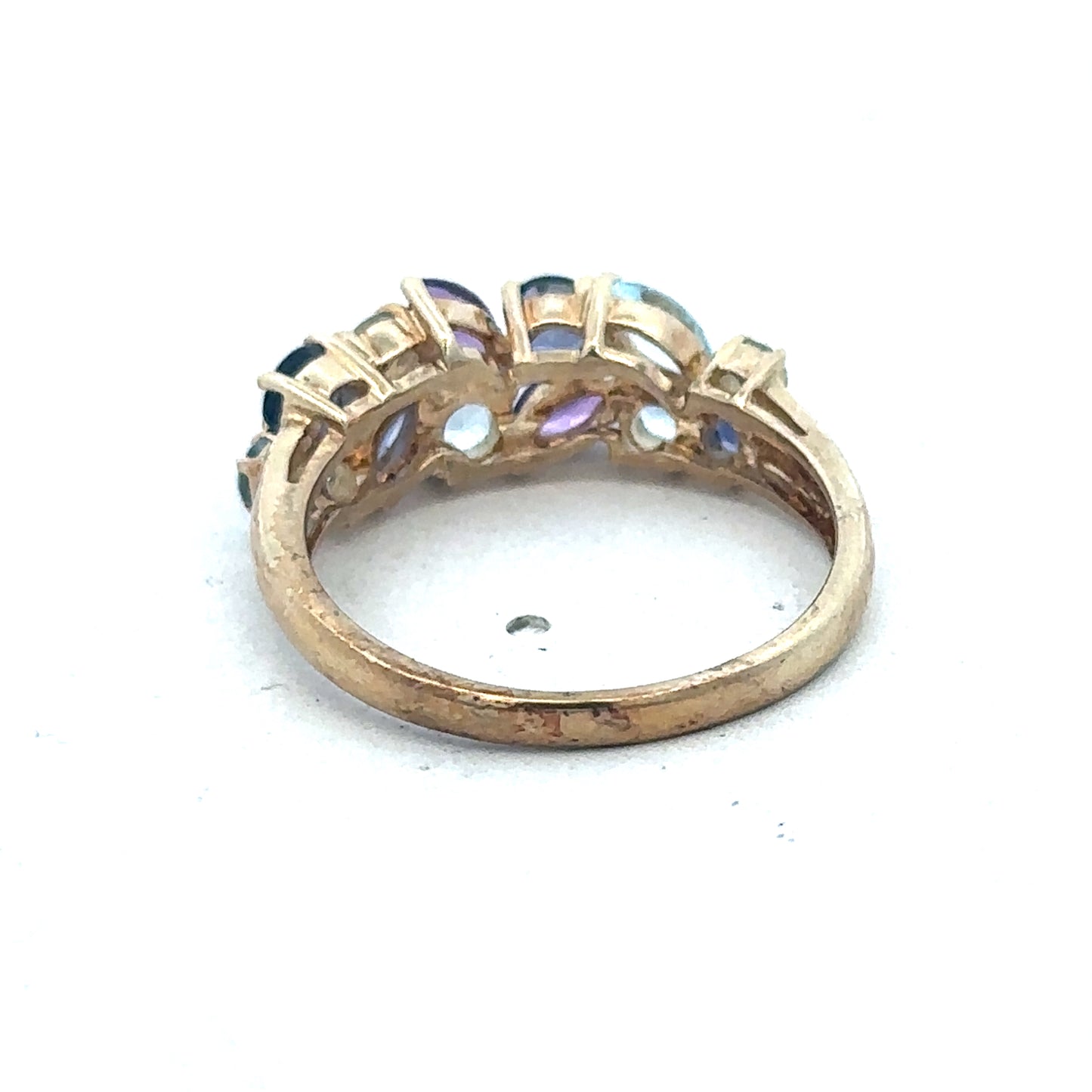 9ct yellow gold gemstone ring by Reeves and Sons featuring a central gemstone set in a polished band.