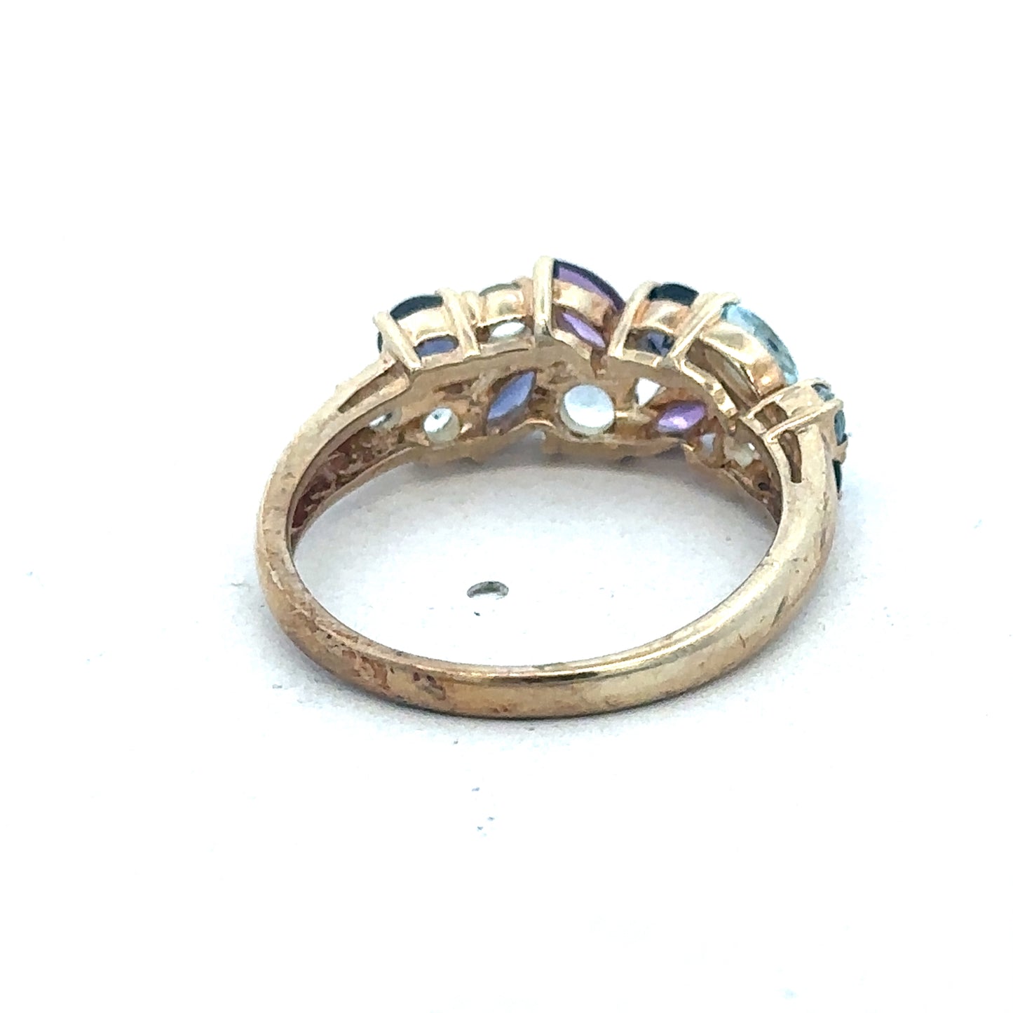 9ct yellow gold gemstone ring by Reeves and Sons with a detailed gemstone setting and polished band.