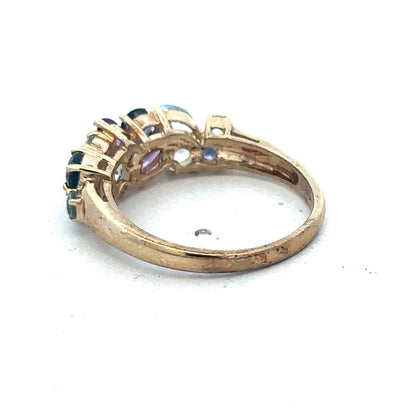 9ct yellow gold gemstone ring by Reeves and Sons, featuring a polished band and a central gemstone.