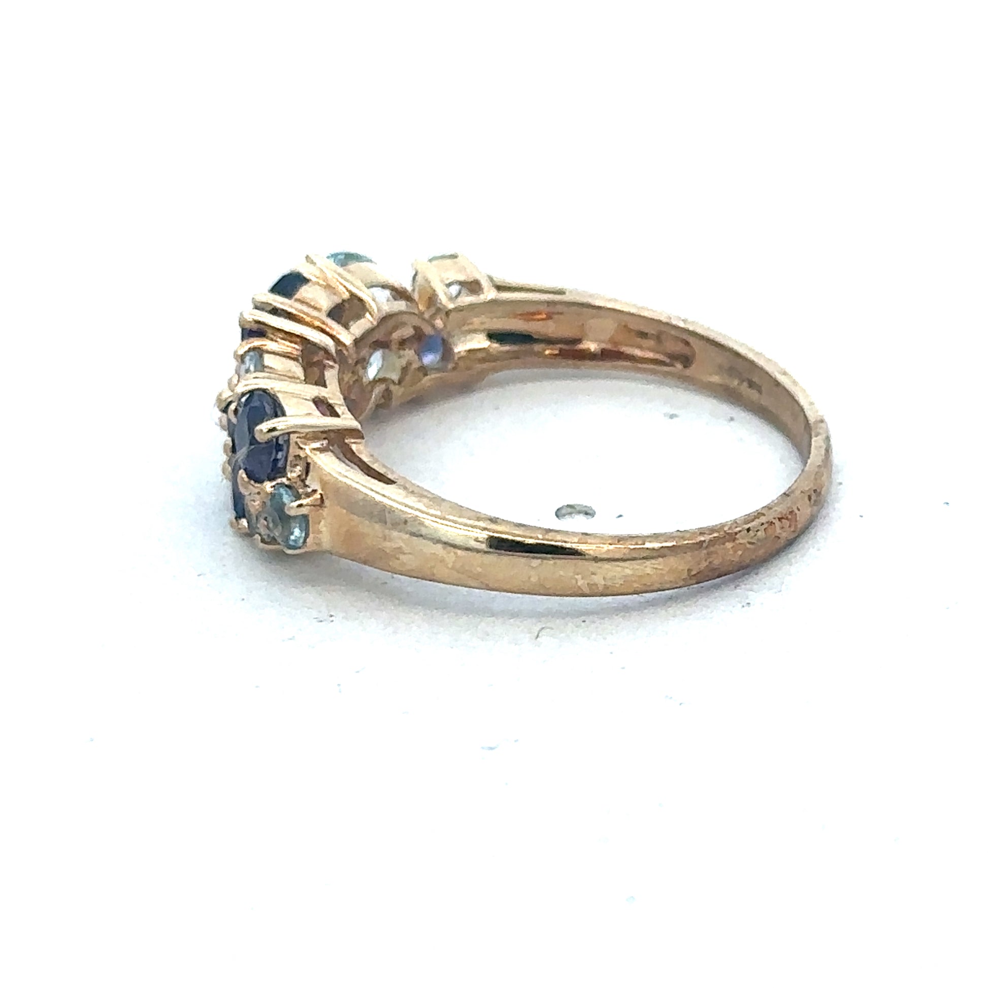 9ct yellow gold gemstone ring by Reeves and Sons, featuring a polished gold band with a central gemstone.