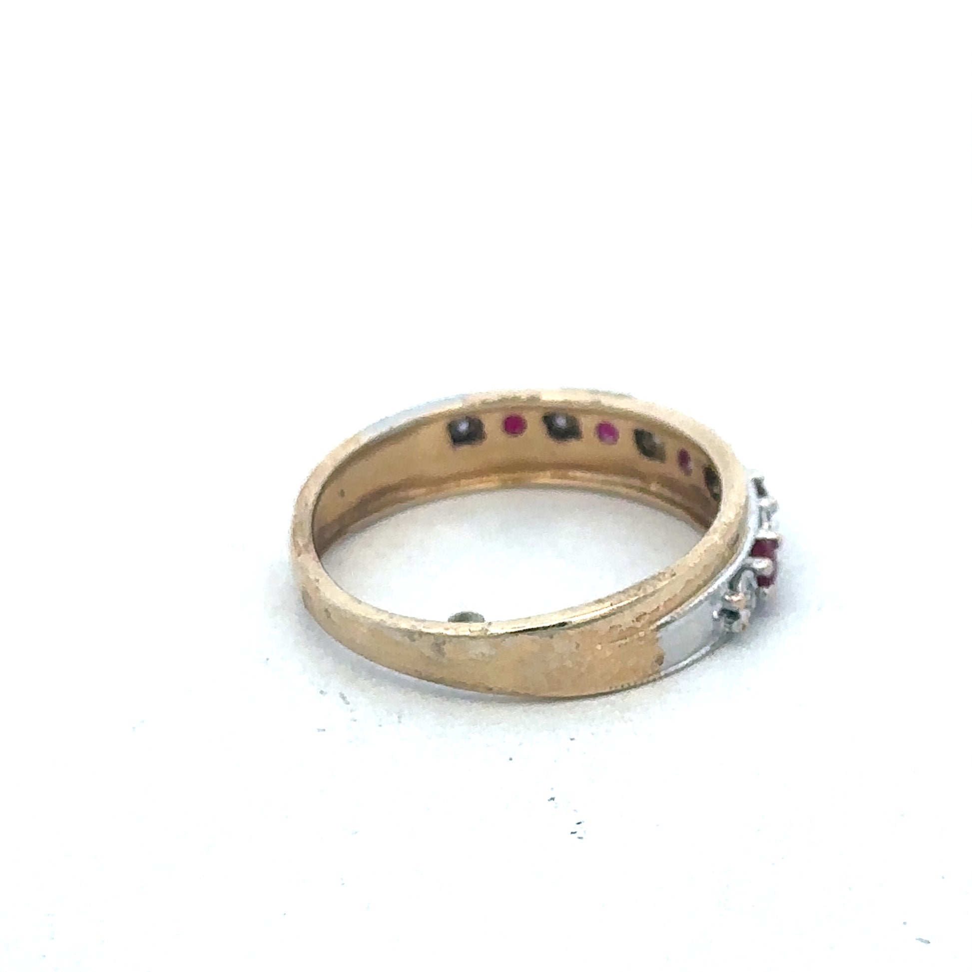 9ct yellow gold ruby and diamond ring with intricate design, featuring vibrant red rubies and sparkling diamonds by Reeves and Sons.