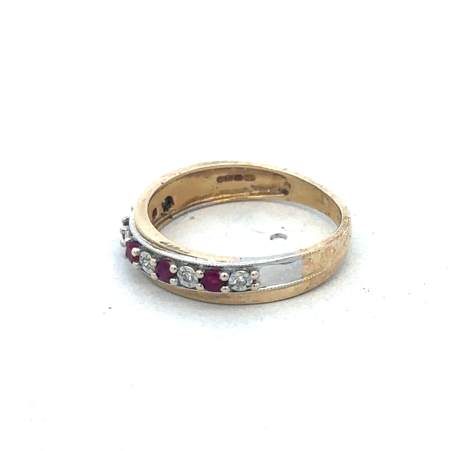 9ct yellow gold ring with ruby and diamond accents, crafted by Reeves and Sons, featuring a detailed close-up of the jewelry.