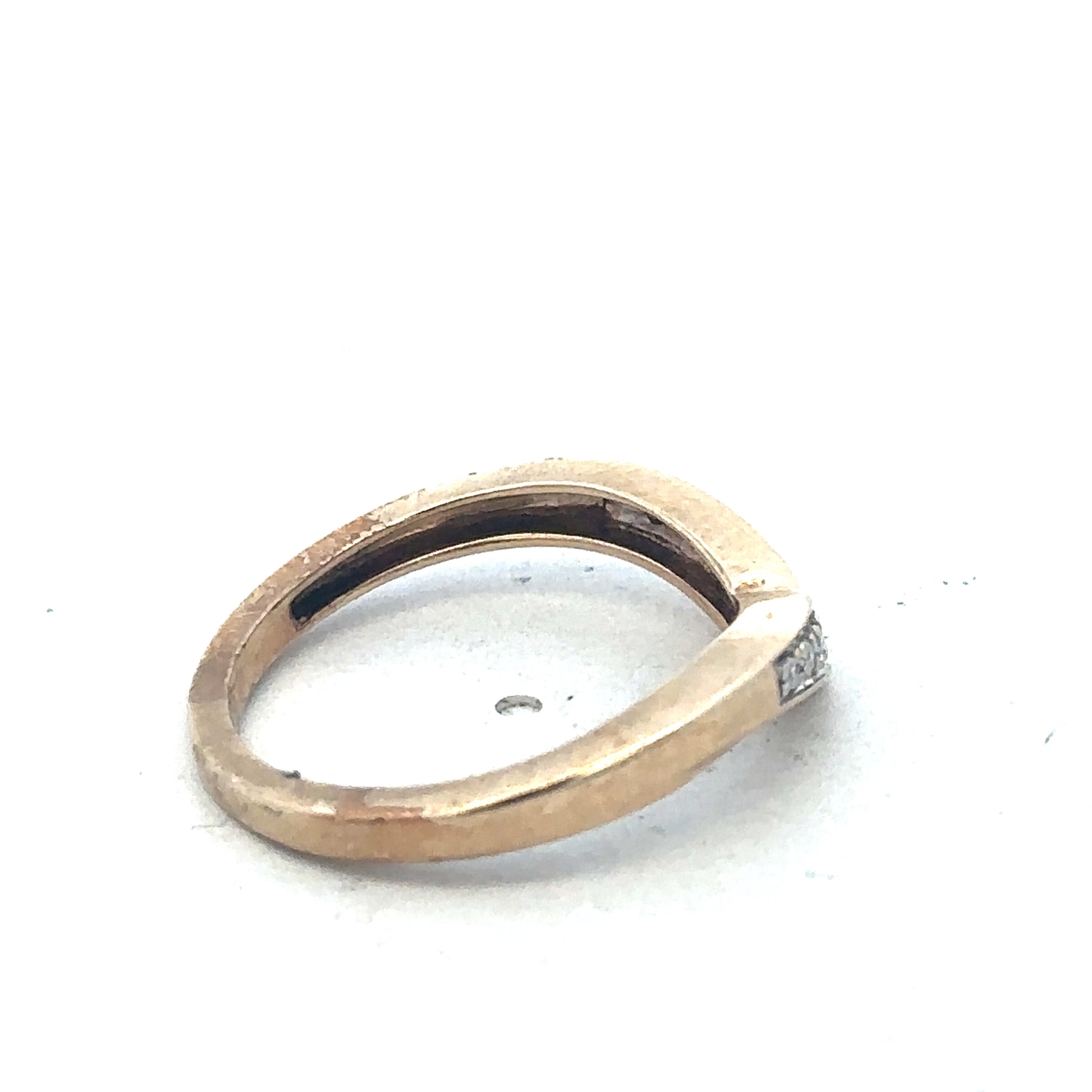 9ct yellow gold diamond wishbone ring by Reeves and Sons, close-up of the elegant ring with sparkling diamonds.