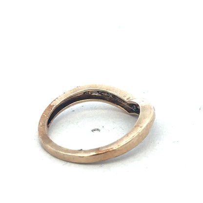 9ct yellow gold diamond wishbone ring by Reeves and Sons, close-up of the elegant ring with sparkling diamonds on a white background