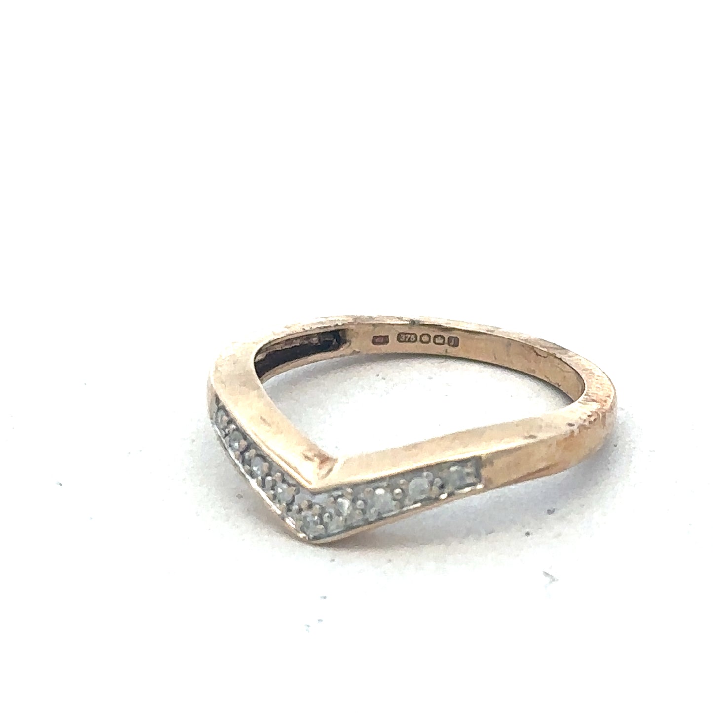 9ct yellow gold diamond wishbone ring by Reeves and Sons with sparkling diamonds and a sleek, elegant design.