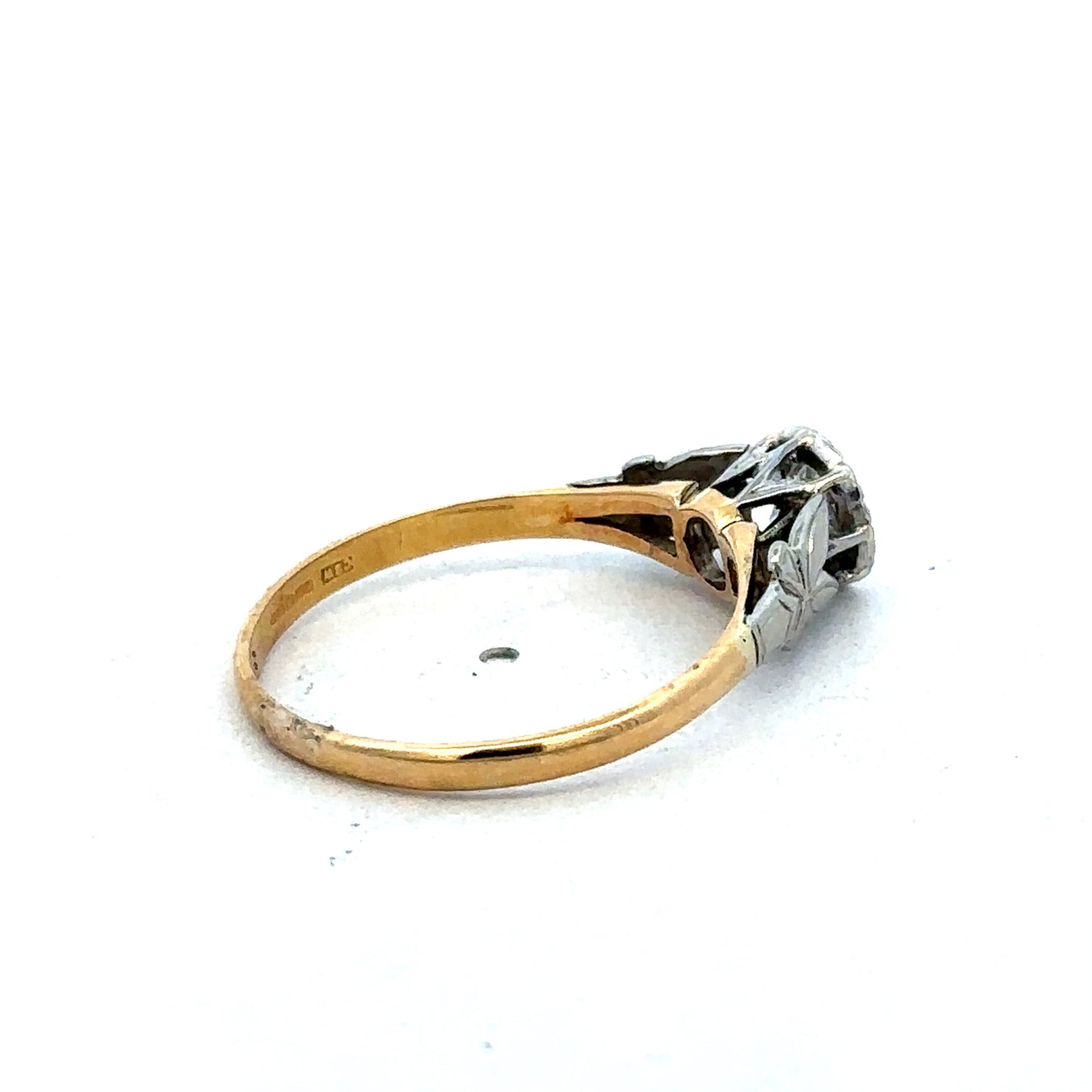 18ct yellow gold diamond ring by Reeves and Sons featuring a sparkling diamond centerpiece and elegant design.
