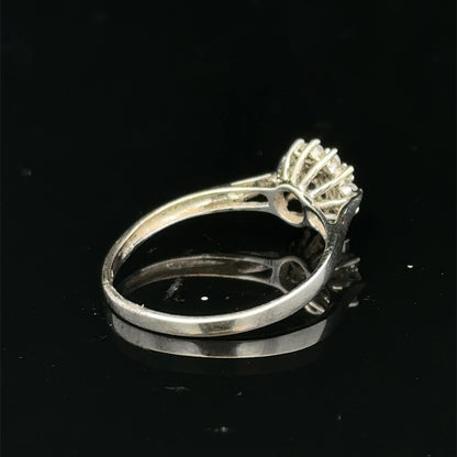 9ct white gold diamond cluster ring by Reeves and Sons featuring a sparkling diamond cluster design.