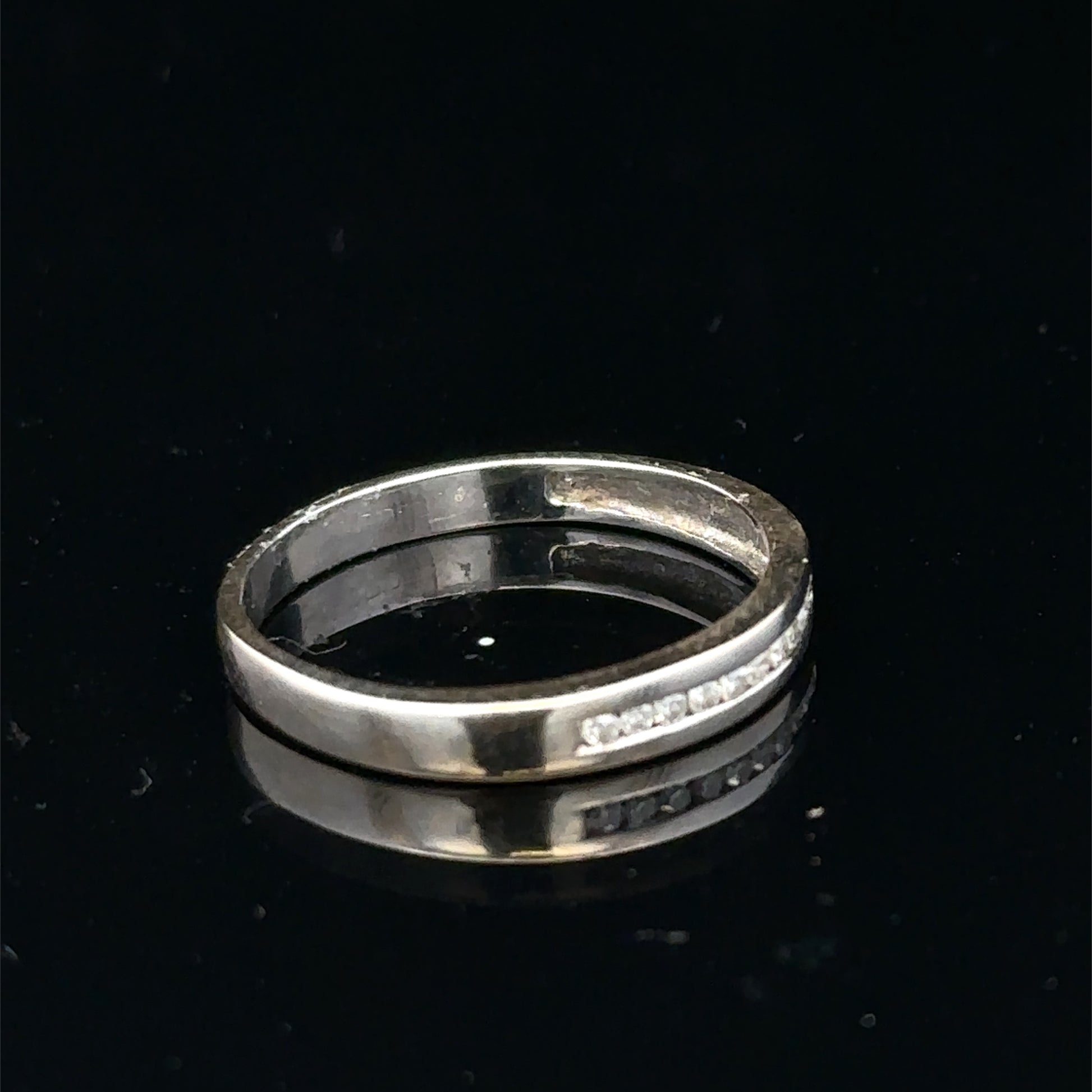 18ct white gold diamond half eternity ring with sparkling diamonds, crafted by Reeves and Sons.