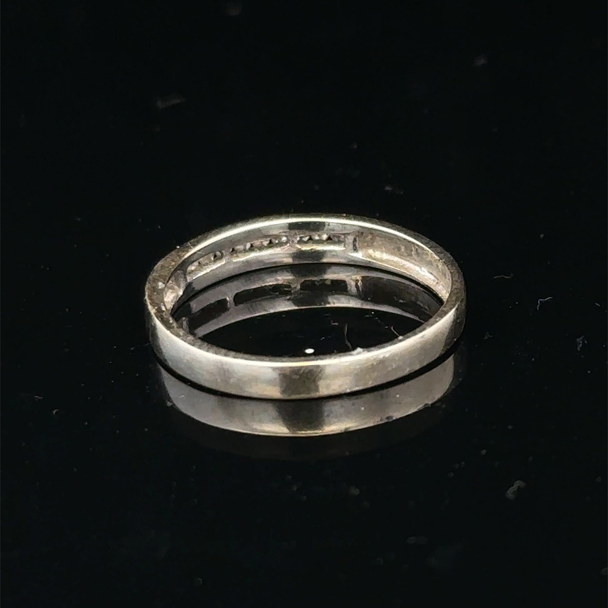 18ct white gold diamond half eternity ring with sparkling diamonds, showcasing Reeves and Sons elegant jewelry design.