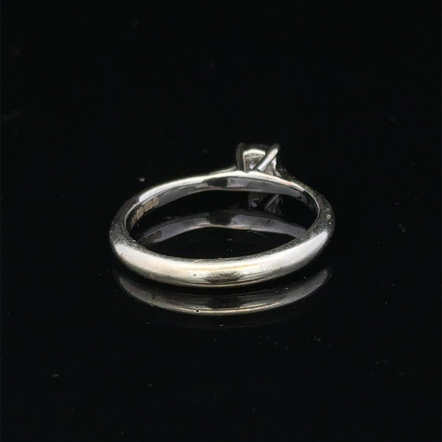 9ct white gold diamond solitaire ring by Reeves and Sons featuring a sparkling central diamond and elegant band design.