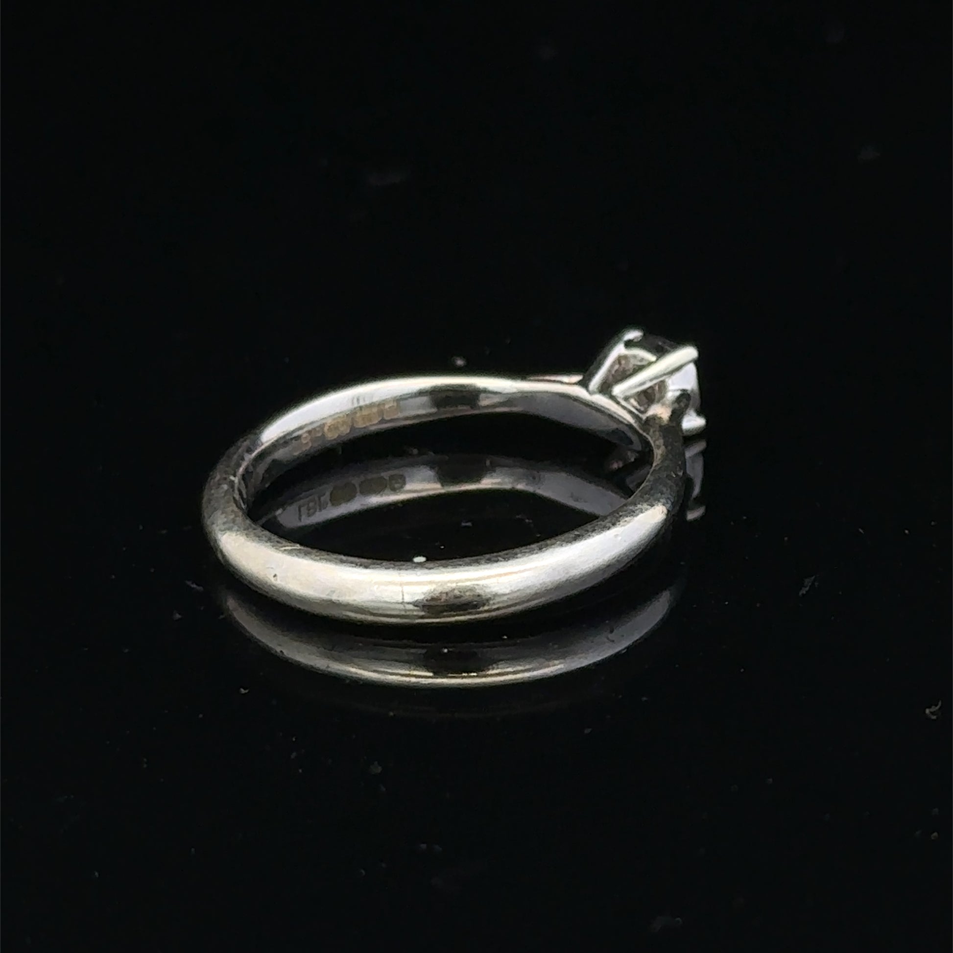 9ct white gold diamond solitaire ring by Reeves and Sons, featuring a single sparkling diamond on a sleek band.