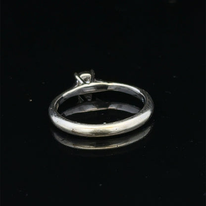 9ct white gold diamond solitaire ring by Reeves and Sons, featuring a sparkling central diamond and elegant design.