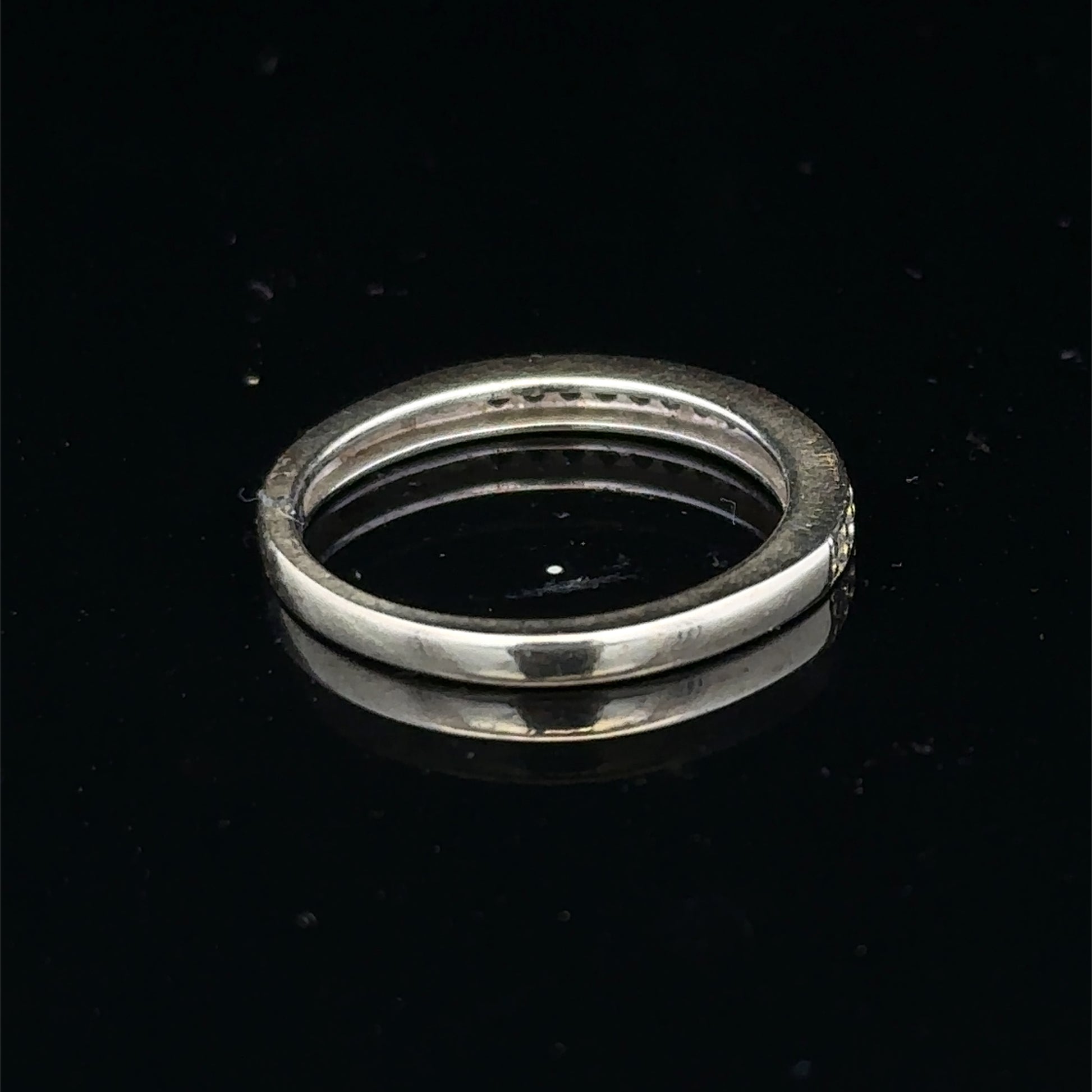 9ct white gold diamond half eternity ring with sparkling diamonds, crafted by Reeves and Sons, showcasing elegance and fine jewelry design.
