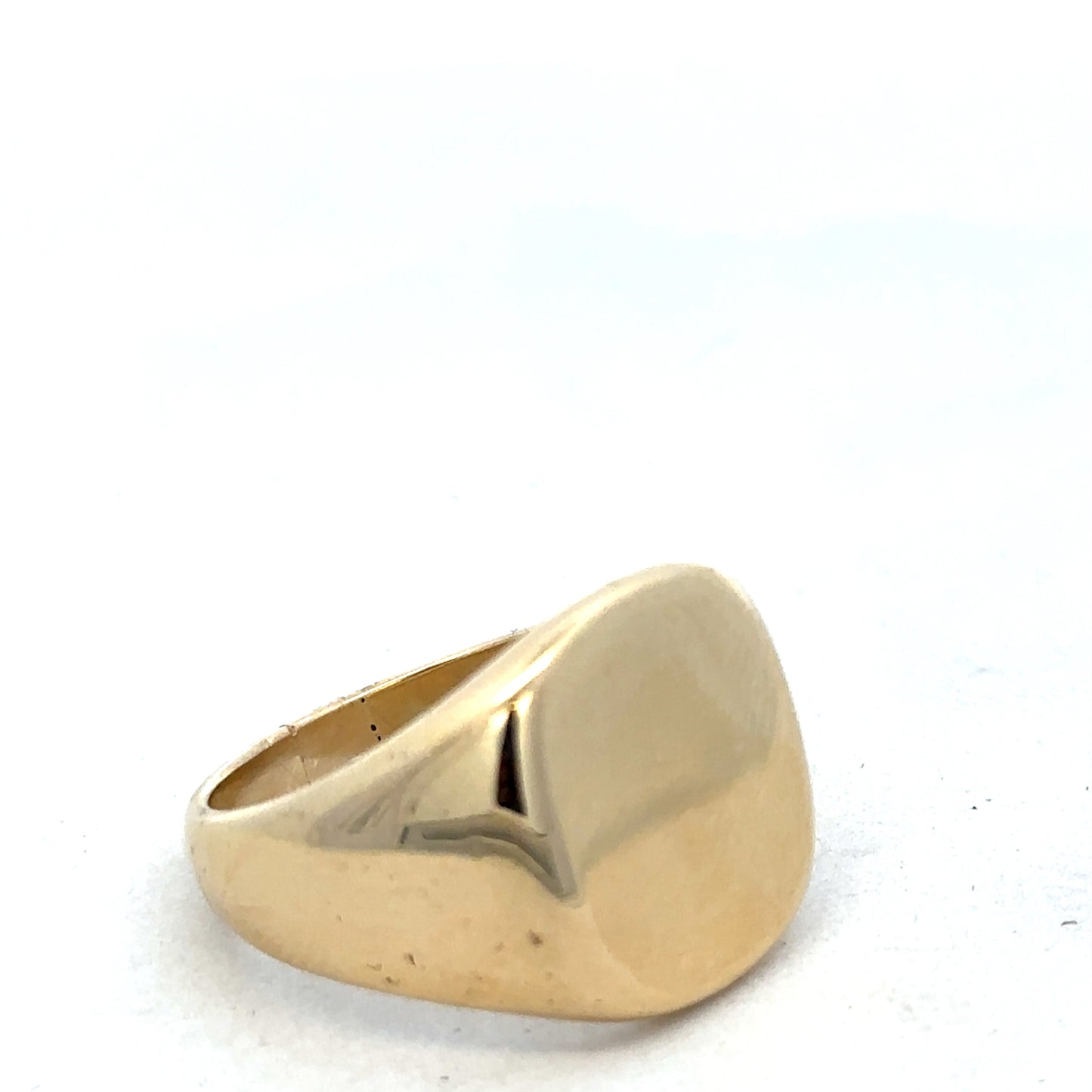 9ct yellow gold signet ring by Reeves and Sons, featuring a polished smooth surface and classic design.