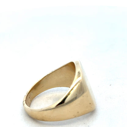 9ct yellow gold signet ring by Reeves and Sons, featuring a polished surface and classic design, displayed on a neutral background.