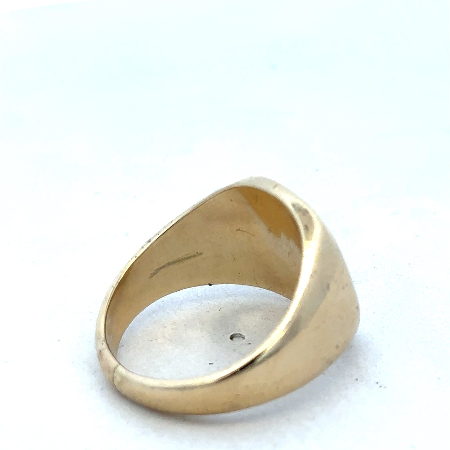 9ct yellow gold signet ring by Reeves and Sons, featuring a polished smooth top and classic design.