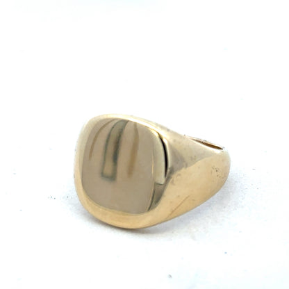 9ct yellow gold signet ring by Reeves and Sons, featuring a smooth polished surface and classic ring design.