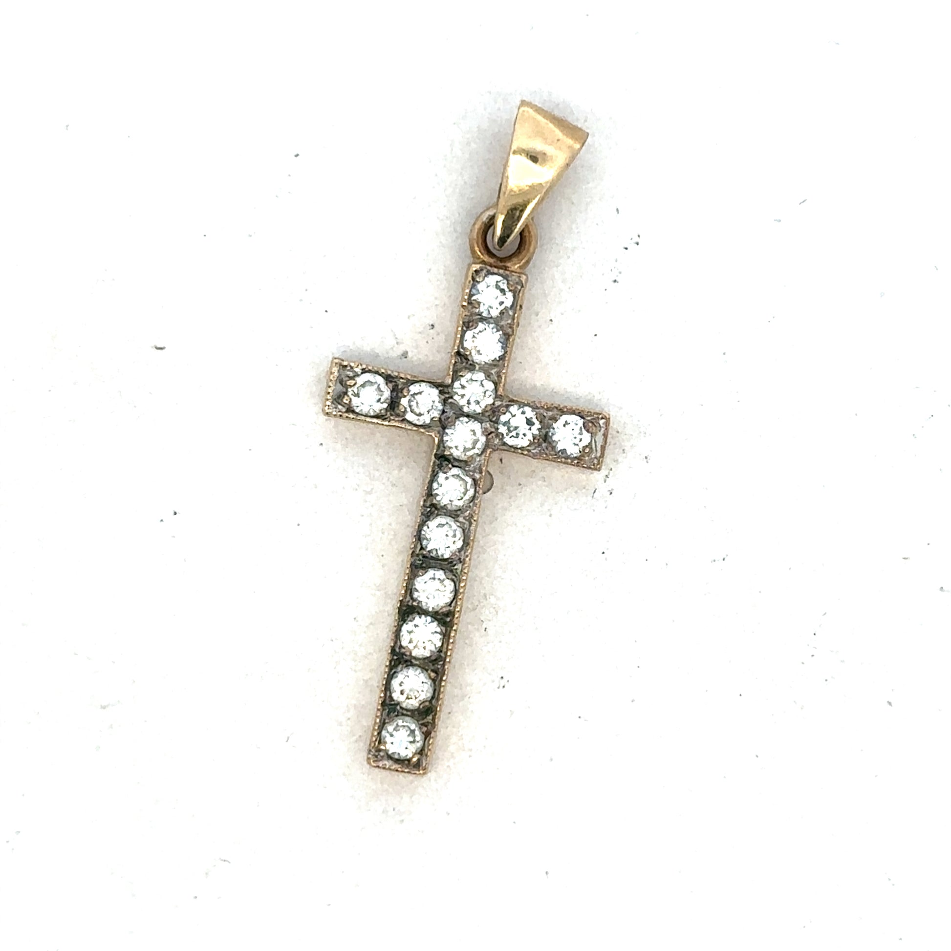 9ct yellow gold cross pendant by Reeves and Sons, featuring a detailed religious symbol with polished finish.