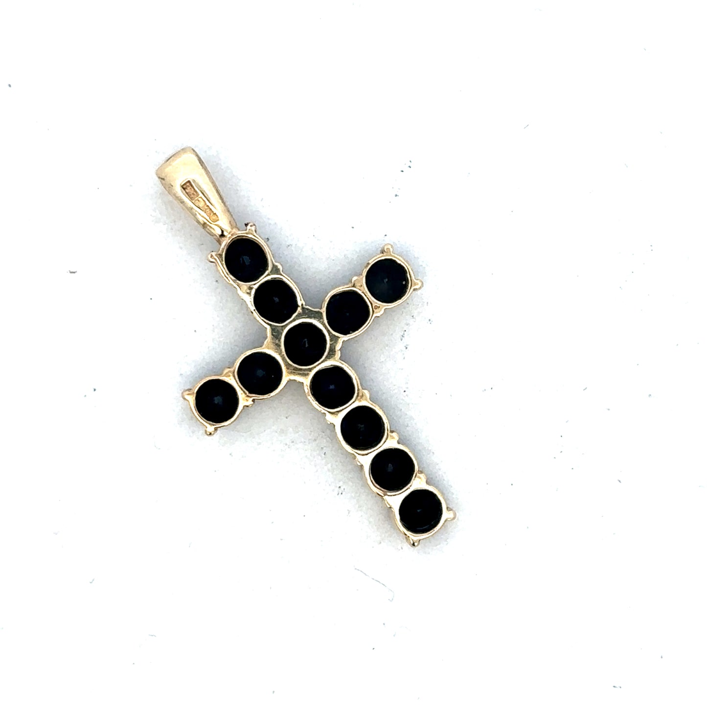 9ct yellow gold cross pendant by Reeves and Sons, featuring a simple and elegant design, shown in a close-up image.