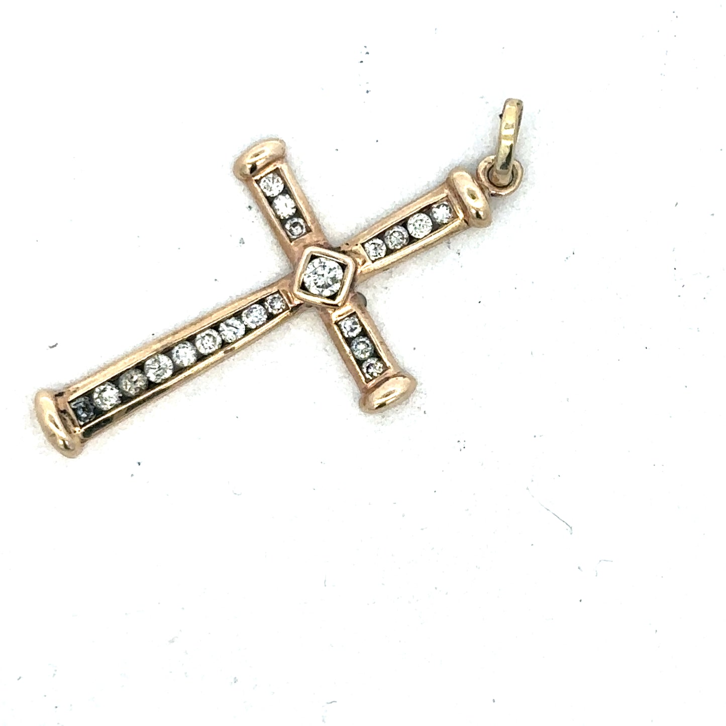 9ct yellow gold diamond cross pendant by Reeves and Sons, featuring a detailed design with sparkling diamonds.