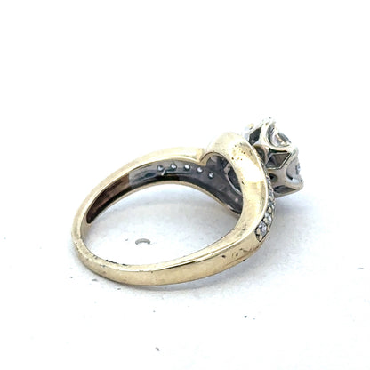 9ct yellow gold diamond ring by Reeves and Sons, featuring a sparkling diamond design, showcased in a close-up image.