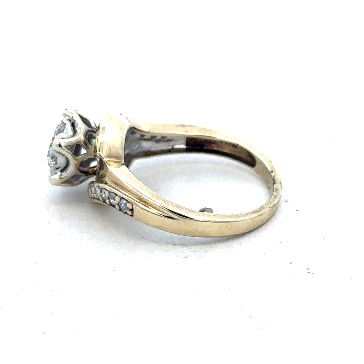 9ct yellow gold diamond ring by Reeves and Sons with sparkling diamonds, elegant design, and polished finish.