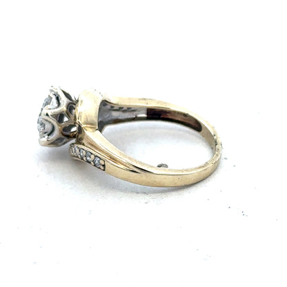 9ct yellow gold diamond ring by Reeves and Sons with sparkling diamonds, elegant design, and polished finish.