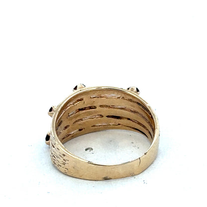 9ct yellow gold ring featuring a smooth band, crafted by Reeves and Sons, shown in close-up detail.