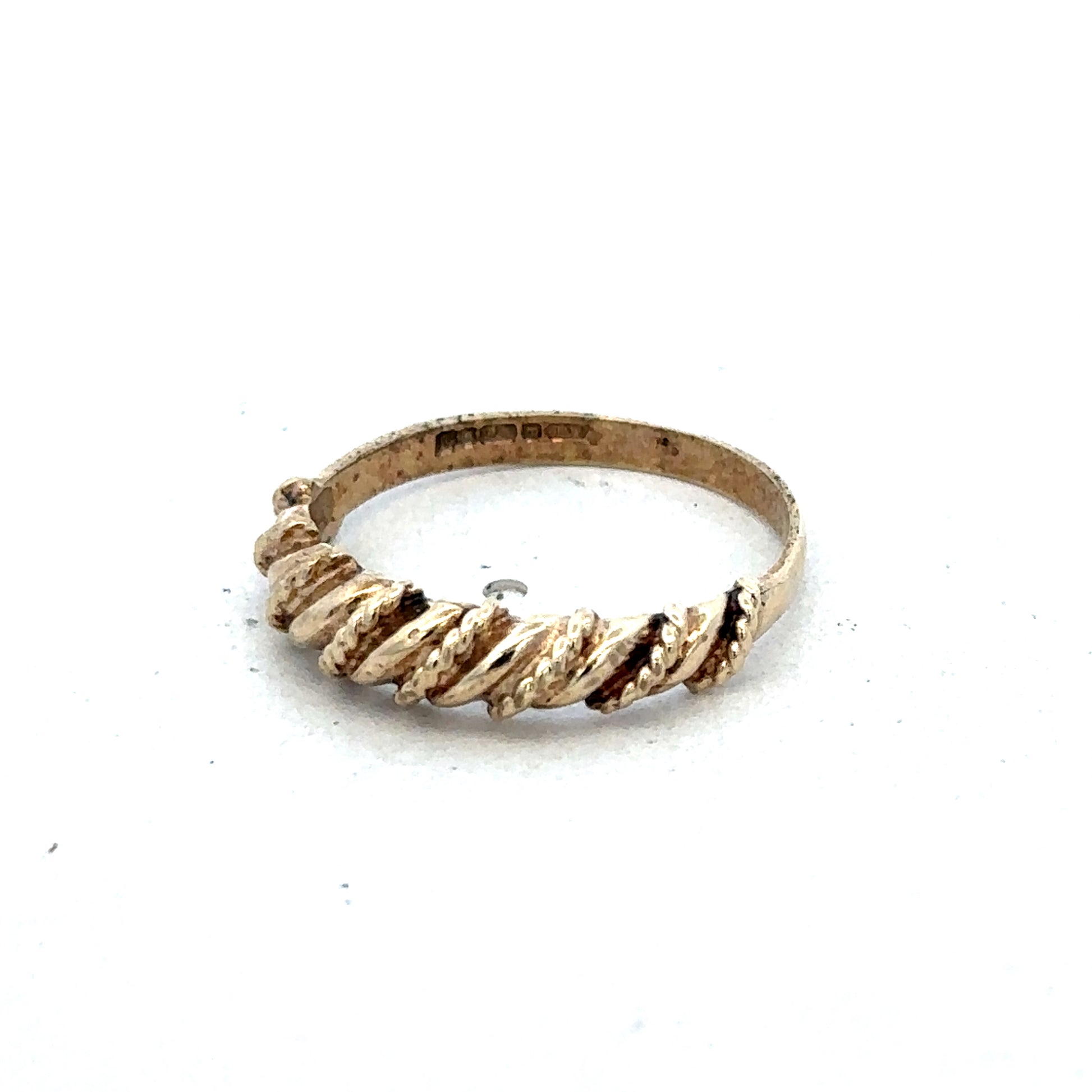9ct yellow gold ring size K with smooth band, crafted by Reeves and Sons, shown in close-up detail.