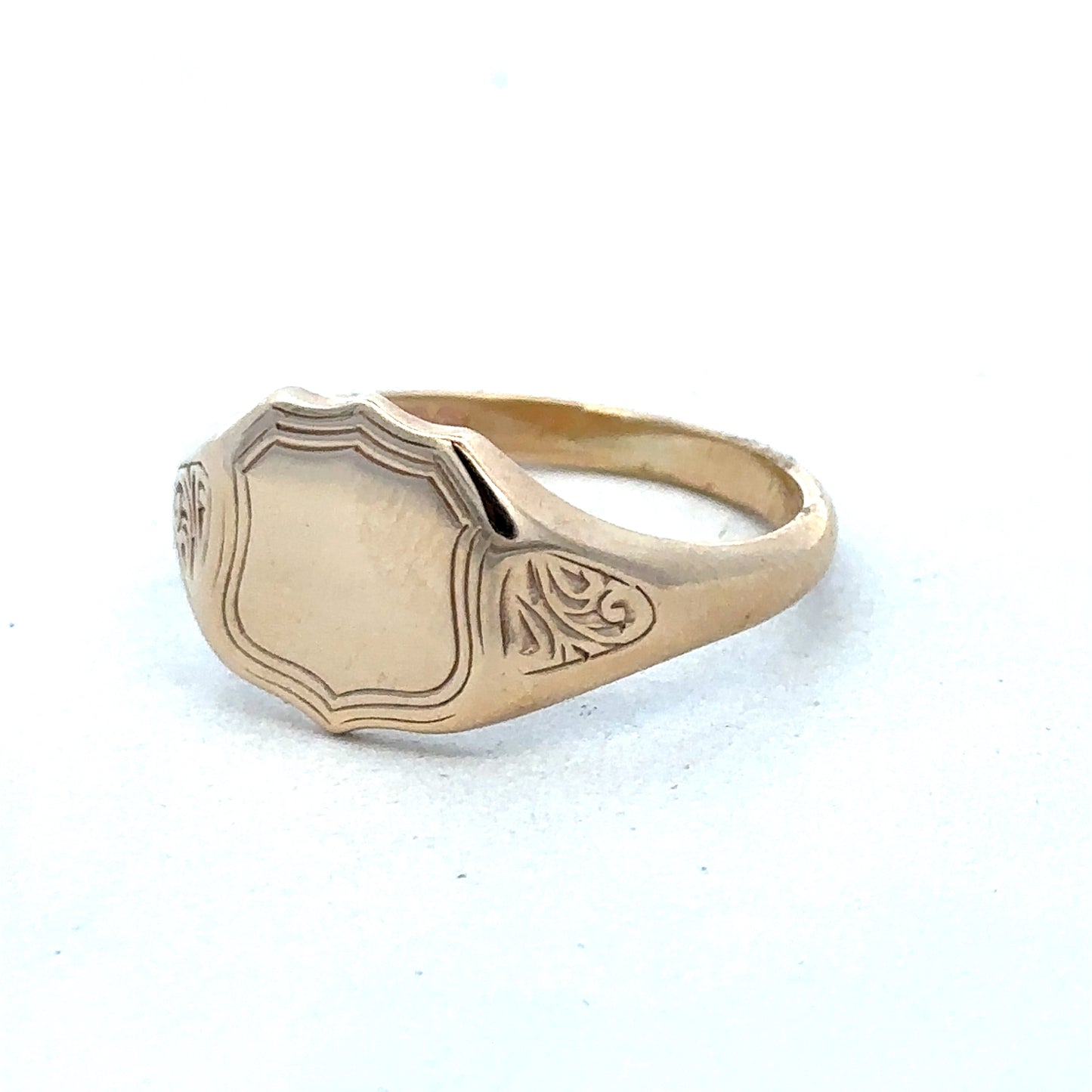 9ct yellow gold signet ring in size T with Reeves and Sons branding, featuring a polished, classic design.