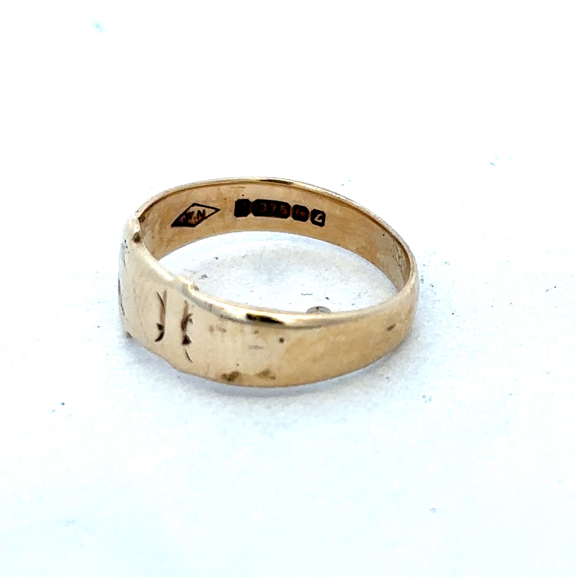 9ct yellow gold buckle ring in size L1/2, Reeves and Sons jewelry, featuring a polished gold buckle design.