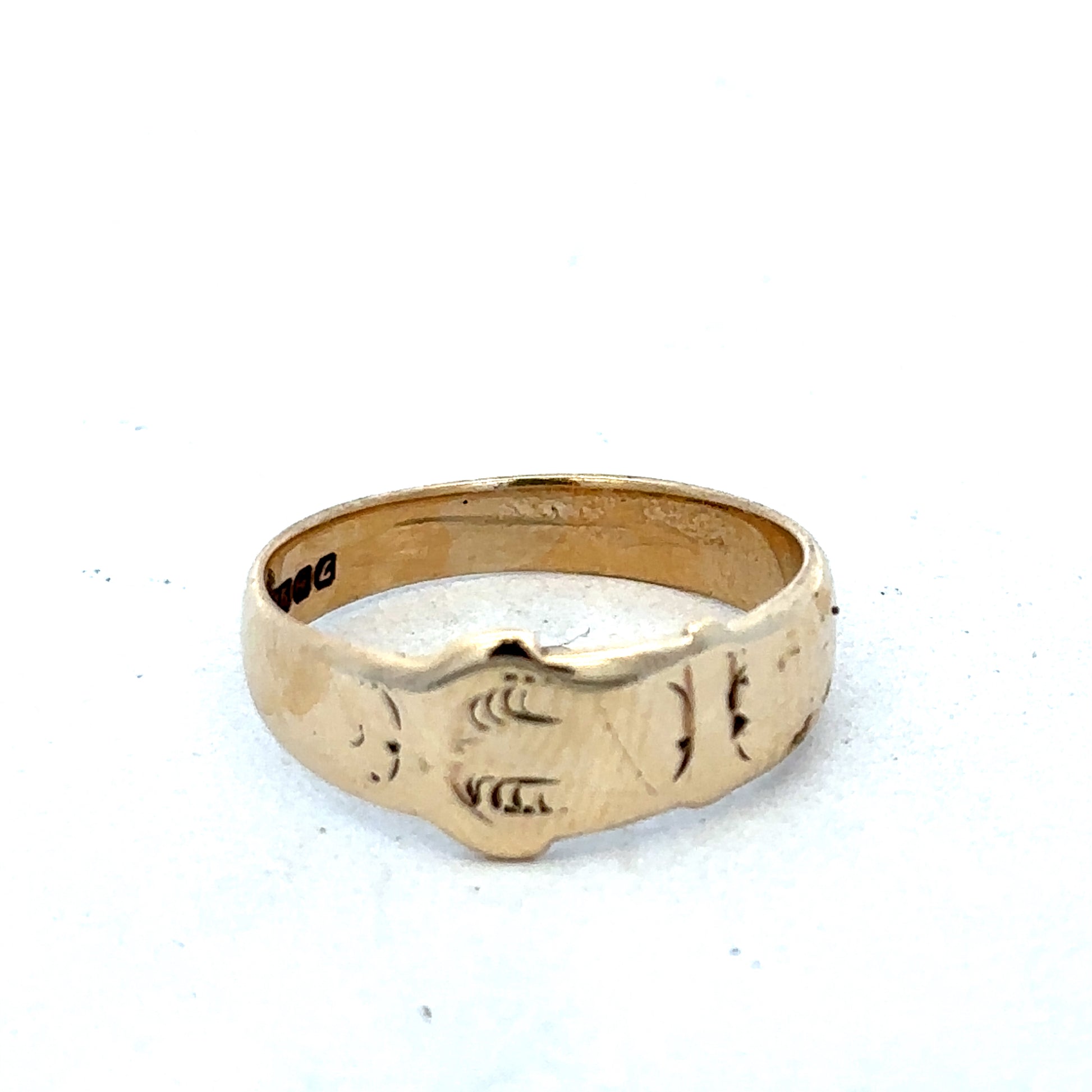 9ct yellow gold buckle ring size L1/2 from Reeves and Sons, featuring a polished gold band with a buckle design.