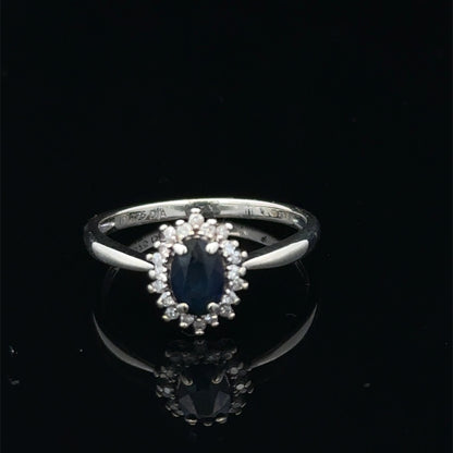 9ct white gold sapphire and diamond ring, size L, with a central sapphire gemstone and diamond accents, by Reeves and Sons.