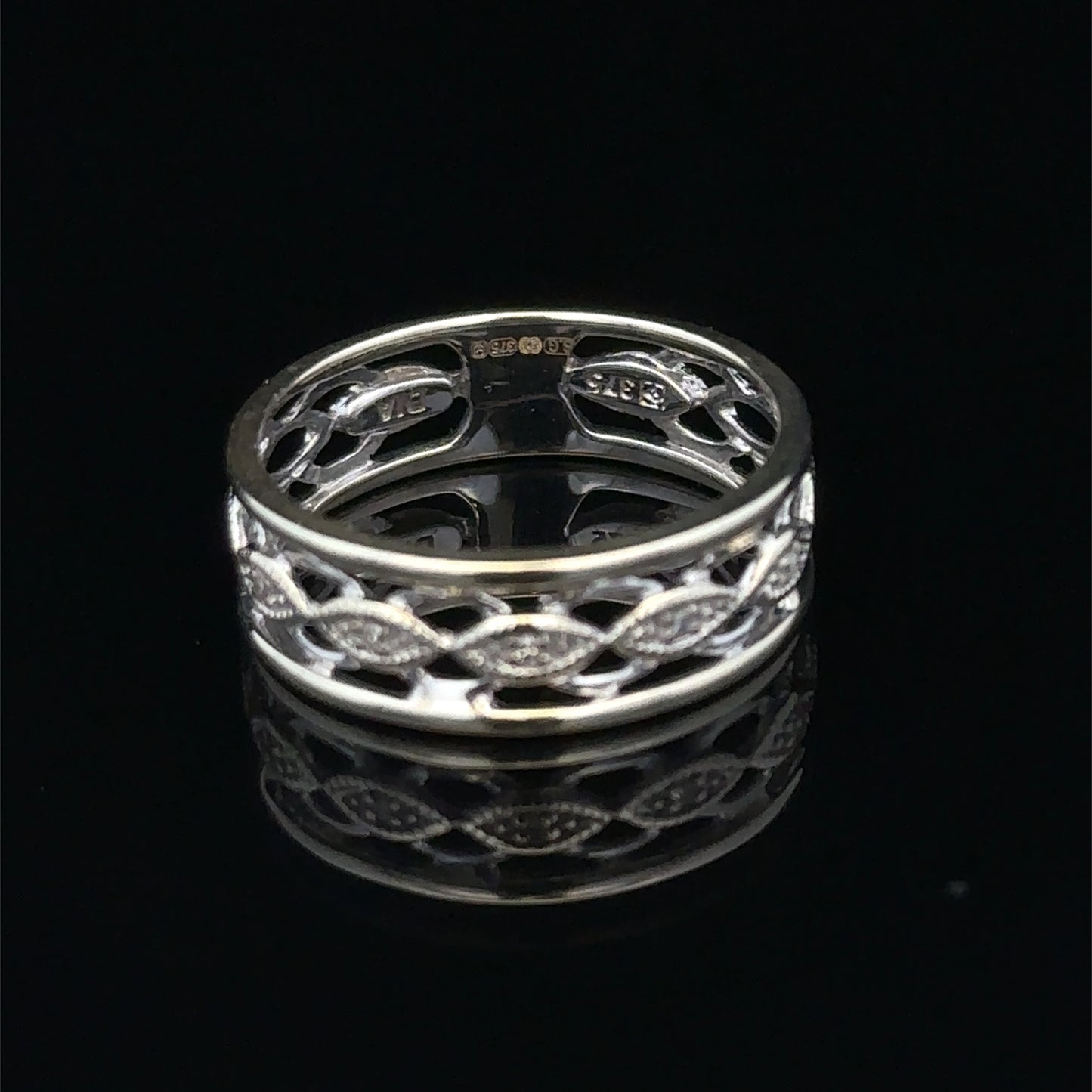 9ct white gold diamond ring in size L with sparkling diamonds, crafted by Reeves and Sons, displayed on a neutral background.