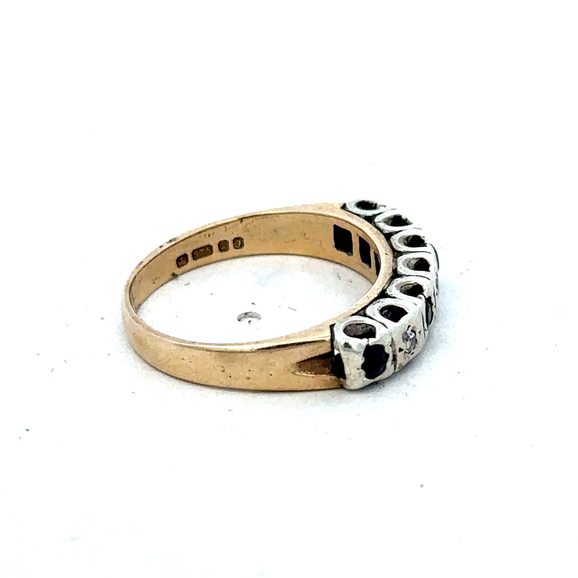 9ct yellow gold sapphire and diamond ring featuring a central sapphire gemstone and diamond accents, size K, Reeves and Sons.