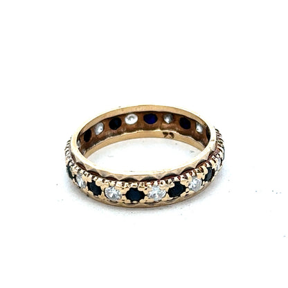 9ct yellow gold ring size M1/2 from Reeves and Sons, featuring a polished band and classic design.