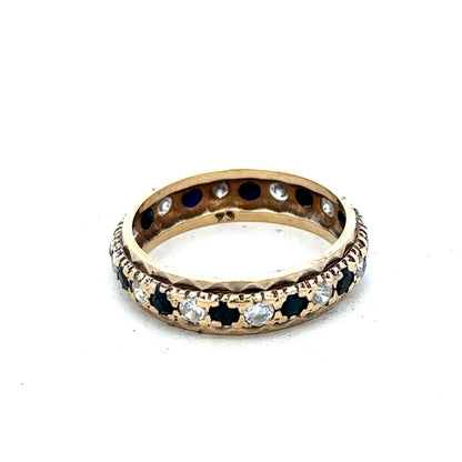 9ct yellow gold ring in size M1/2 from Reeves and Sons, showcasing a polished band with a smooth finish.