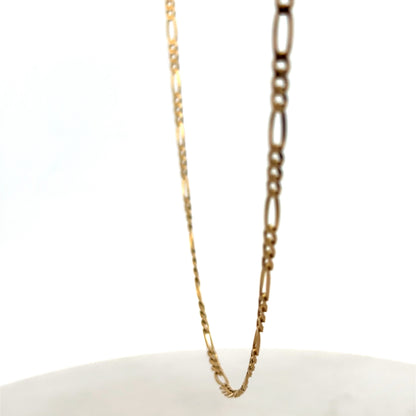 Reeves and Sons 9ct yellow gold figaro chain with a polished finish, weighing 7.1g, displayed on a neutral background.
