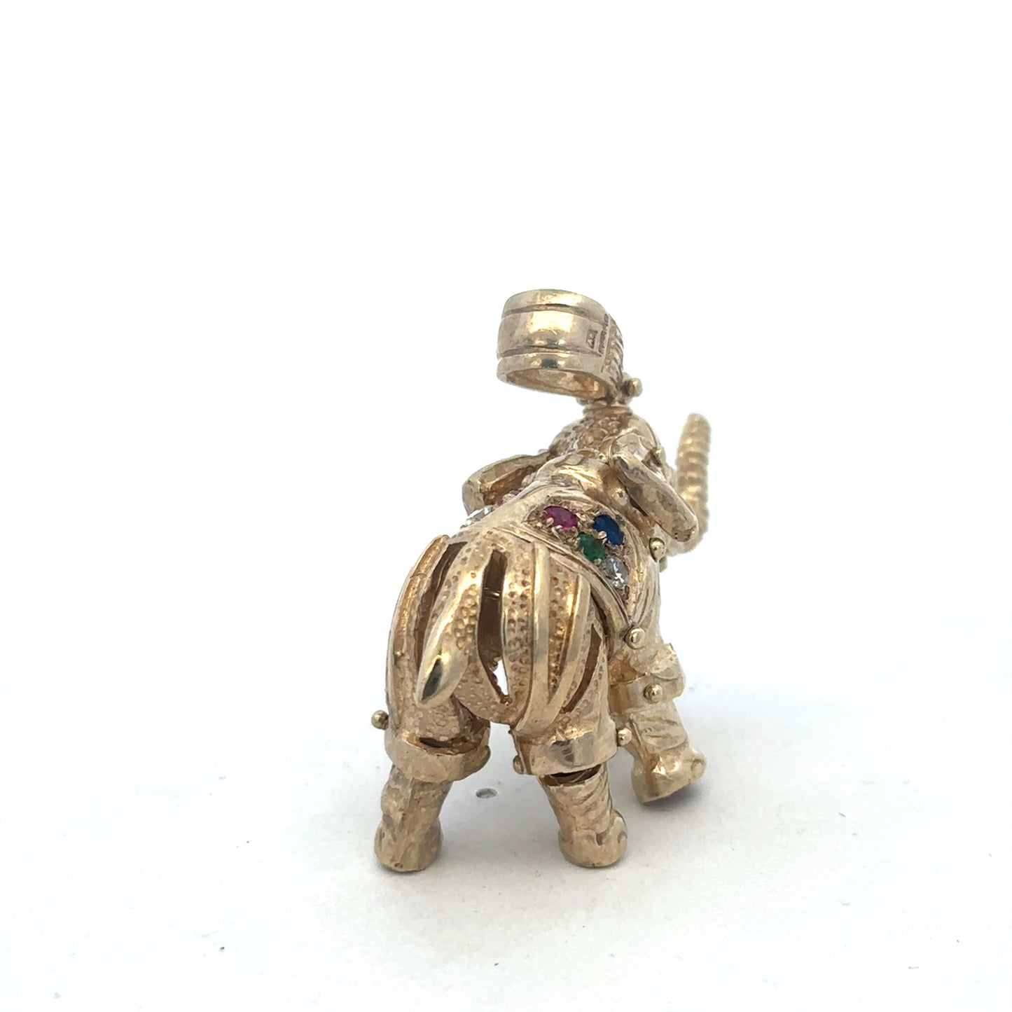 9ct yellow gold elephant pendant with intricate detailing, weighs 25.3g, from Reeves and Sons, displayed on a plain background.