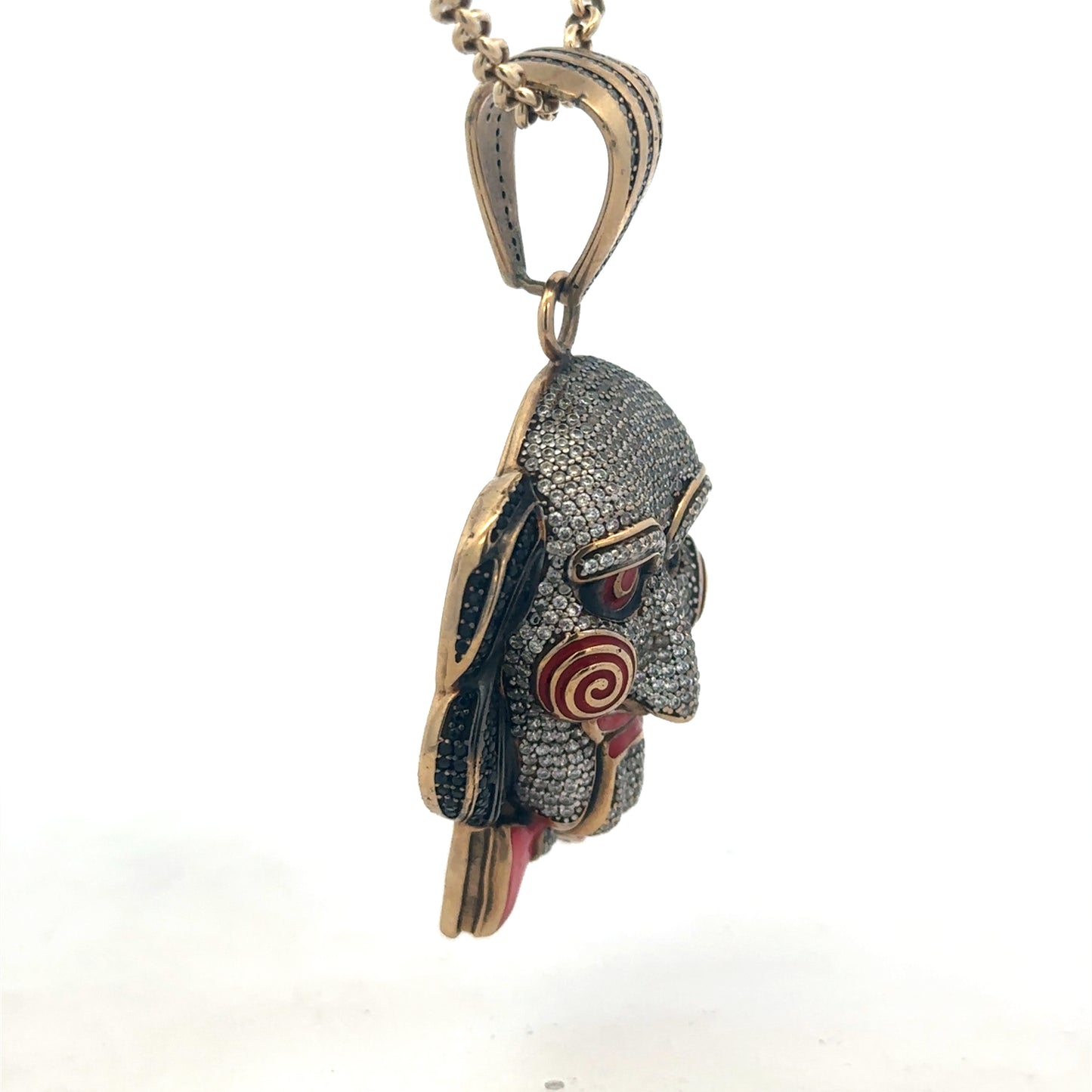 9ct yellow gold jigsaw pendant by Reeves and Sons, detailed design with polished finish, shown on a plain background.