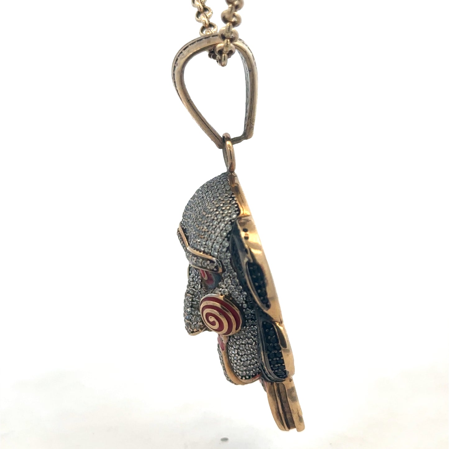 9ct yellow gold jigsaw pendant with Reeves and Sons branding, showcasing intricate puzzle-piece design and polished finish.