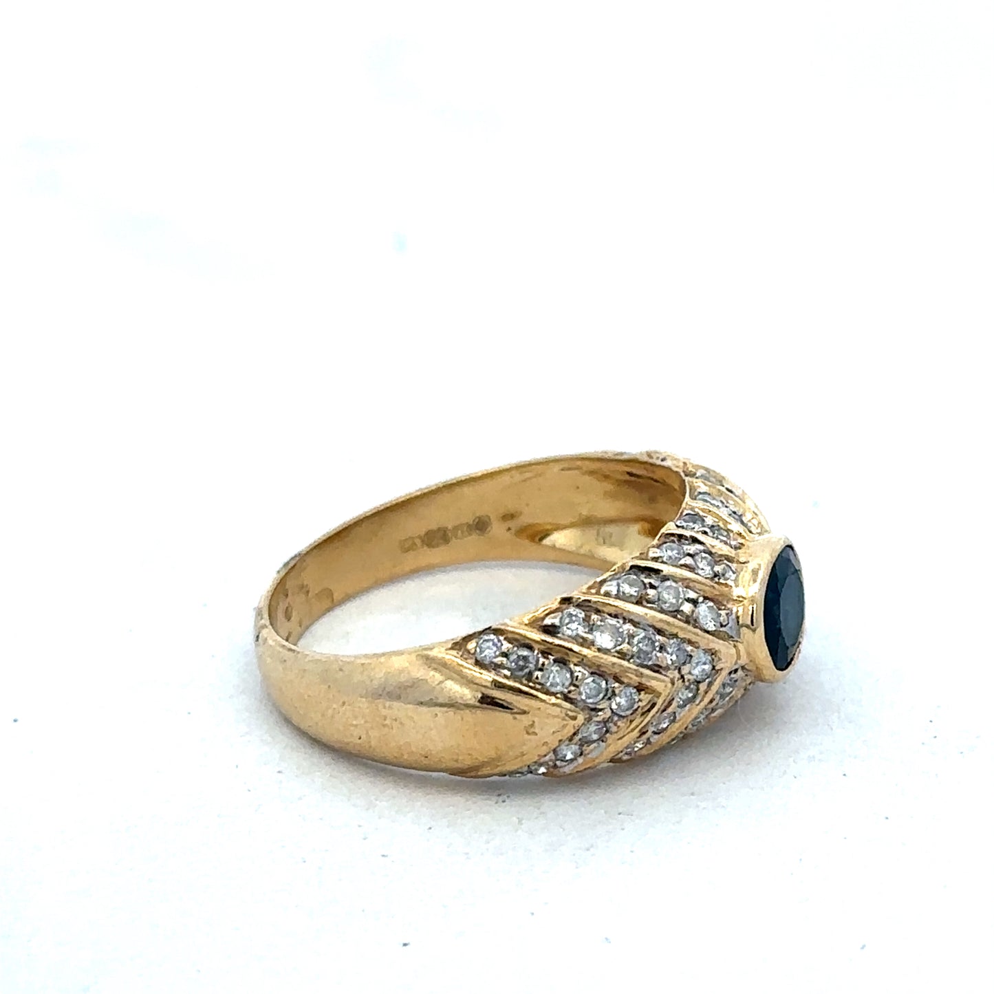 18ct yellow gold diamond ring in size P by Reeves and Sons, featuring sparkling diamonds and a classic design.