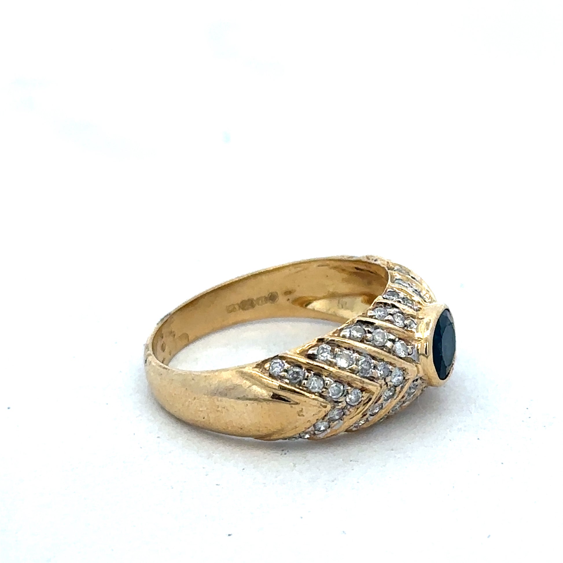 18ct yellow gold diamond ring in size P by Reeves and Sons, featuring sparkling diamonds and a classic design.
