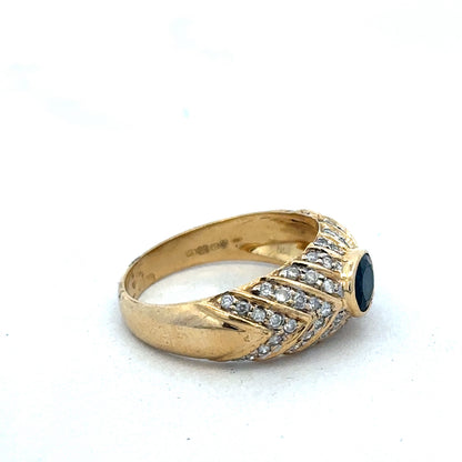 18ct yellow gold diamond ring in size P by Reeves and Sons, featuring sparkling diamonds and a classic design.