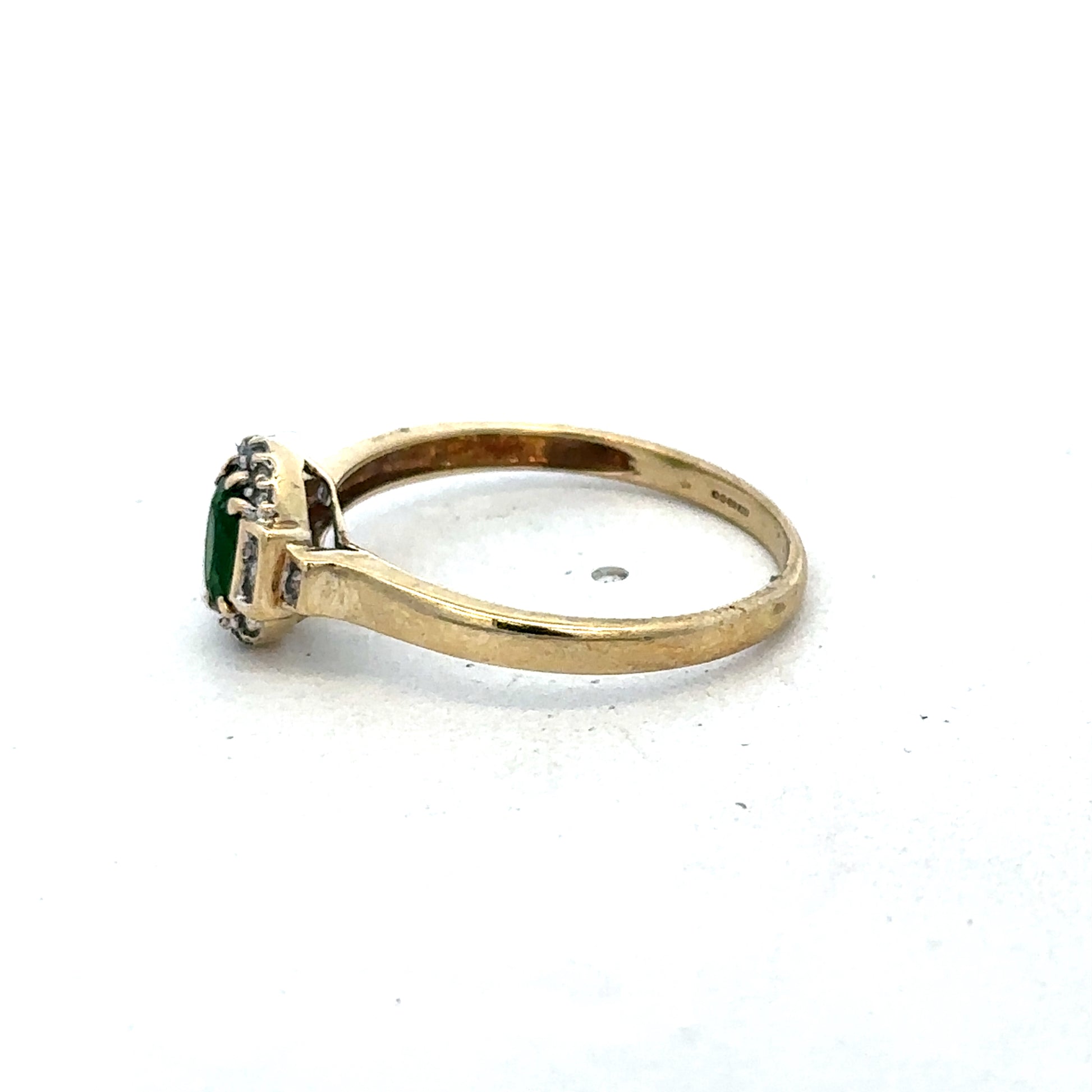 9ct yellow gold emerald and diamond ring, size R, by Reeves and Sons, showcasing a detailed design with sparkling gemstones.