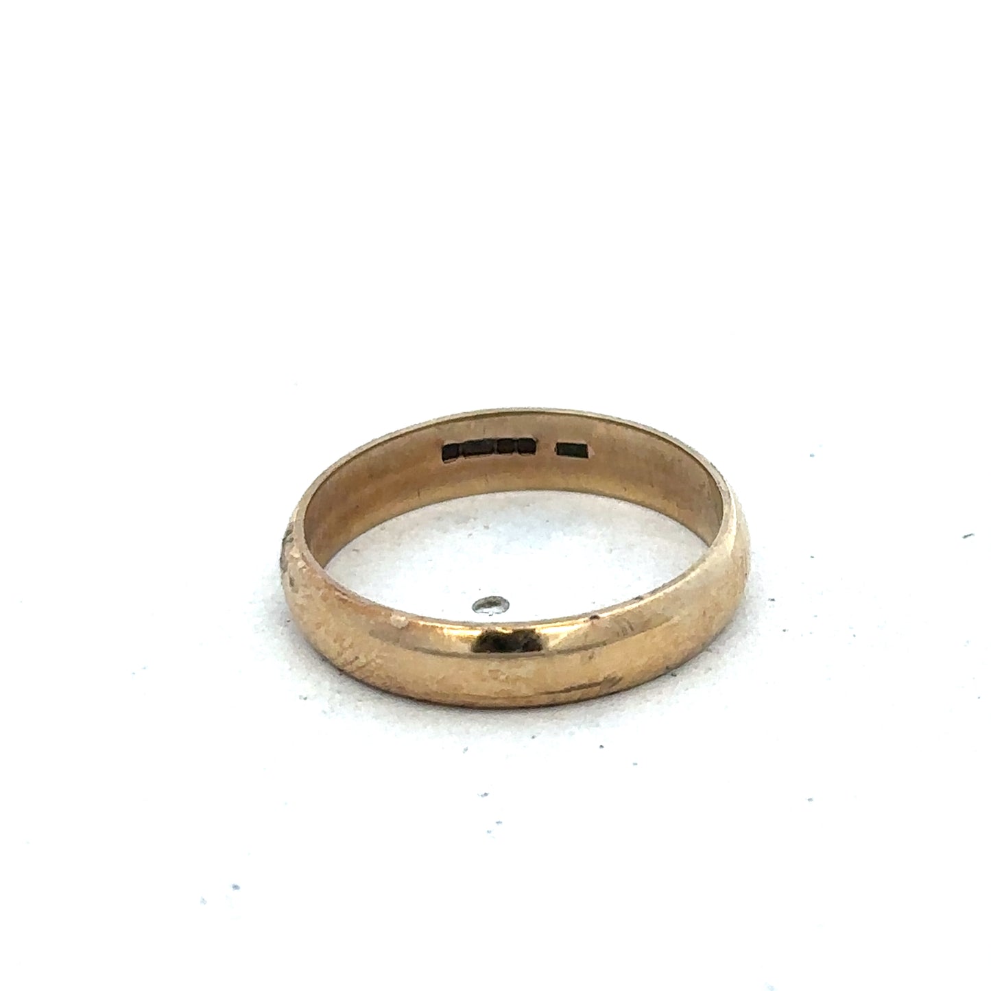 9ct yellow gold band ring in size N with a smooth, polished finish from Reeves and Sons.