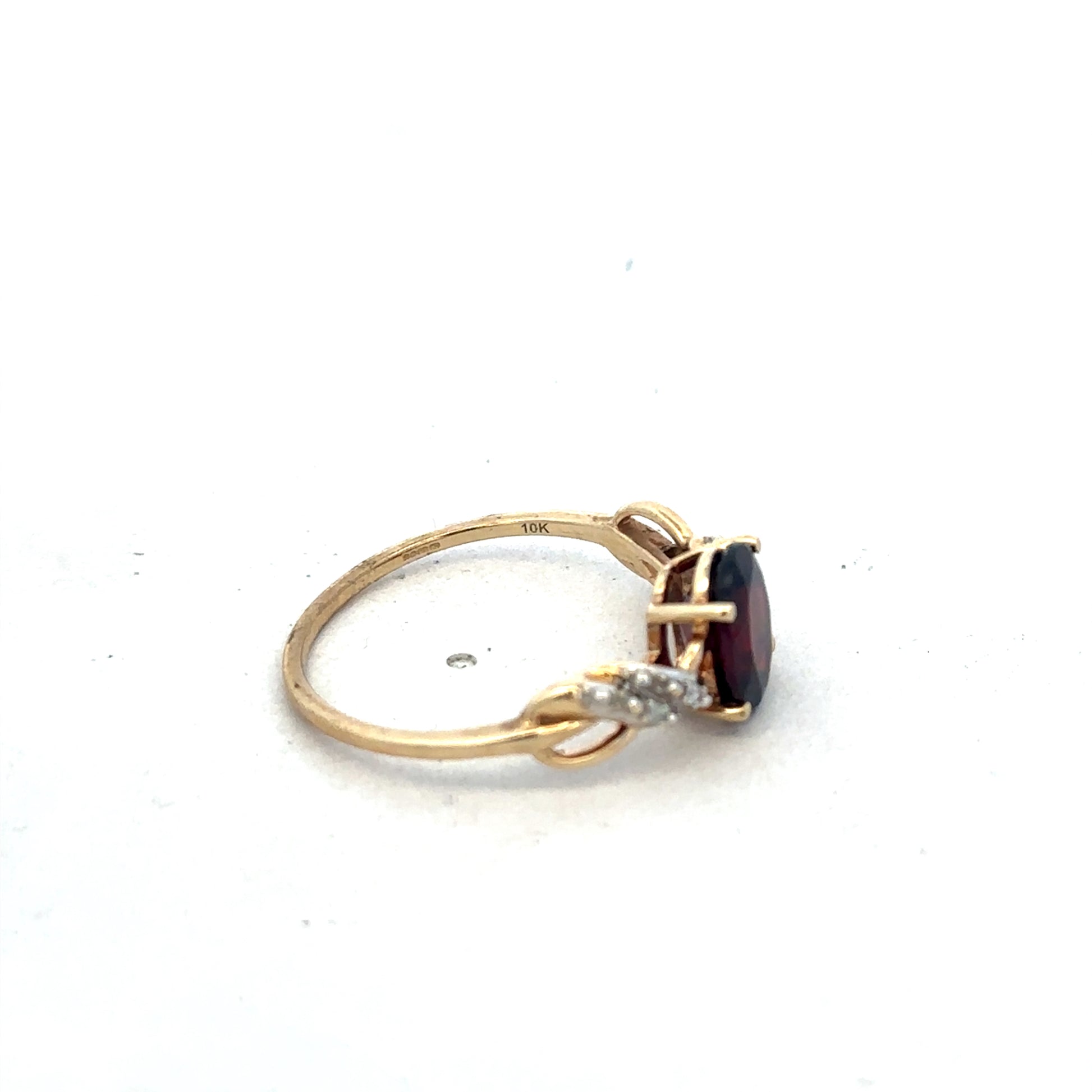 9ct yellow gold garnet and diamond ring, size R1/2, featuring a central garnet stone with diamond accents, by Reeves and Sons.