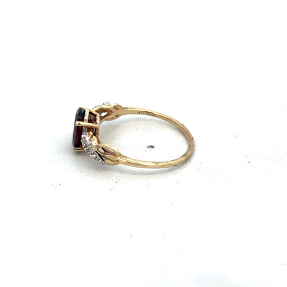 9ct yellow gold garnet and diamond ring in size R1/2, featuring a detailed design by Reeves and Sons.