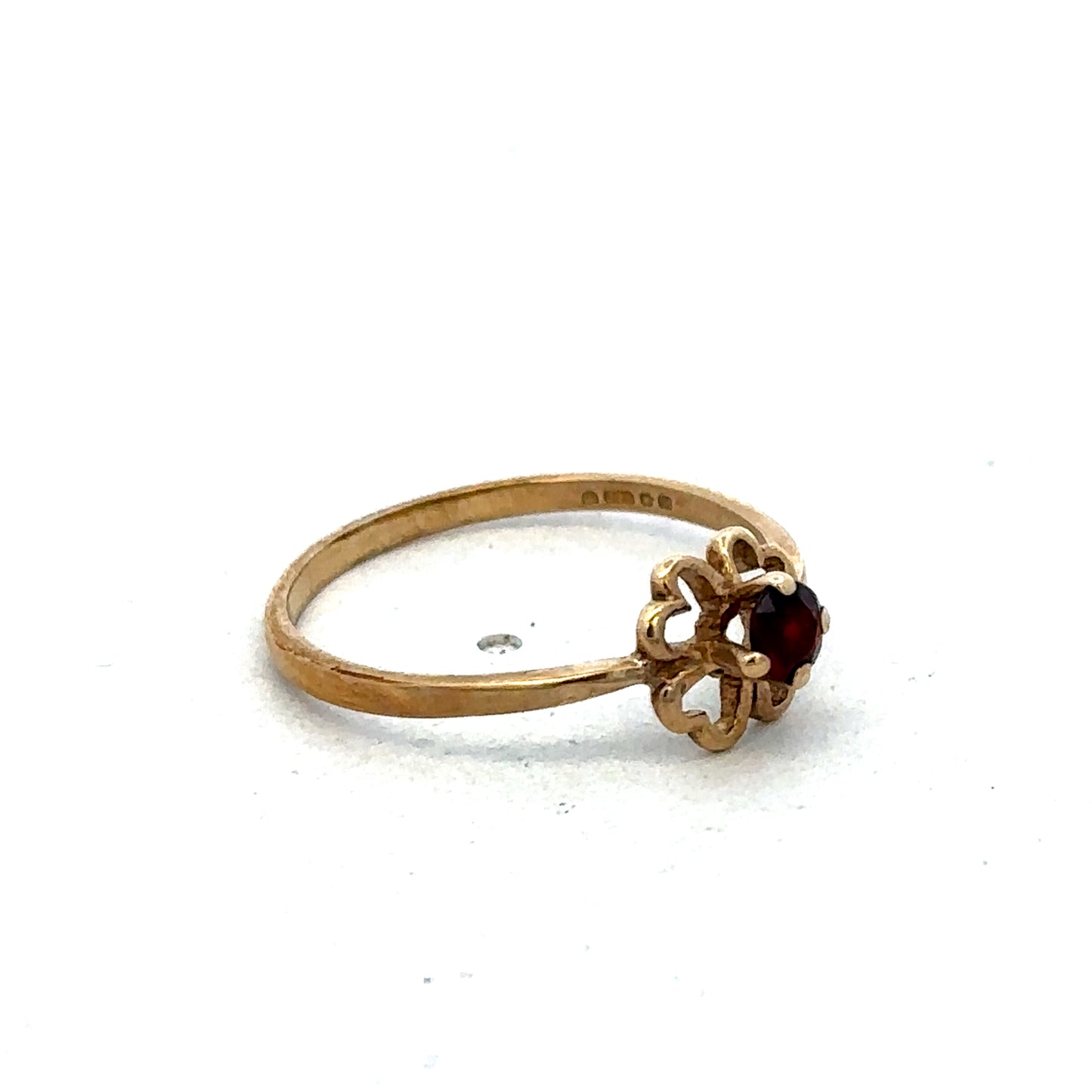 9ct yellow gold ring size M by Reeves and Sons, featuring a smooth band design, displayed on a plain background.