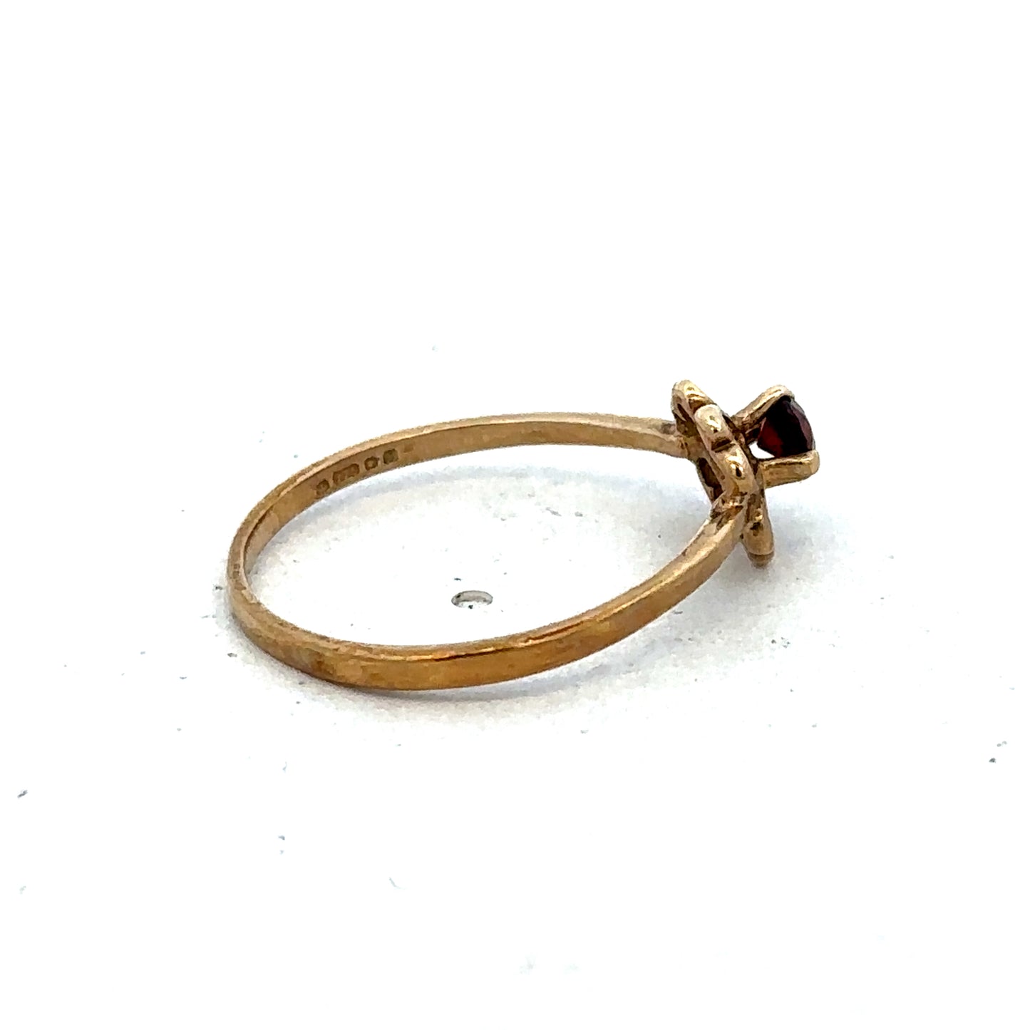 9ct yellow gold ring in size M with a smooth band, crafted by Reeves and Sons, displayed on a neutral background.